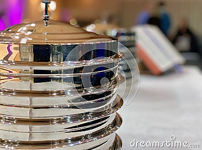 Metallic dishes prepared for the Lordâ€™s Supper in a Baptist Church Stock Photo